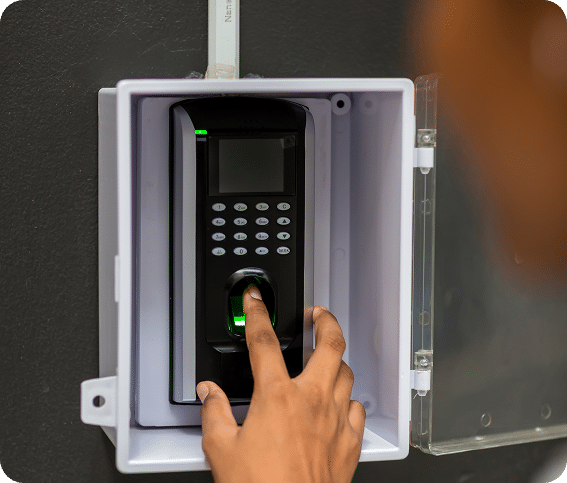 Person typing a code into a keypad (access control)