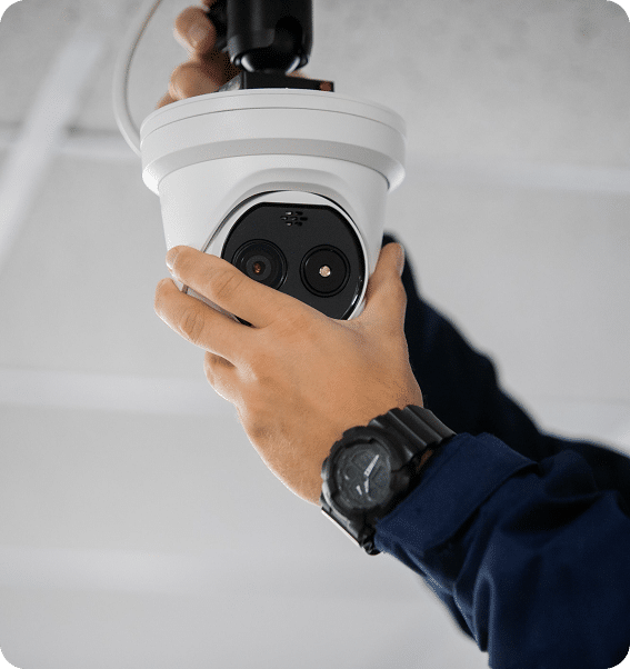 Person installing a surveillance camera