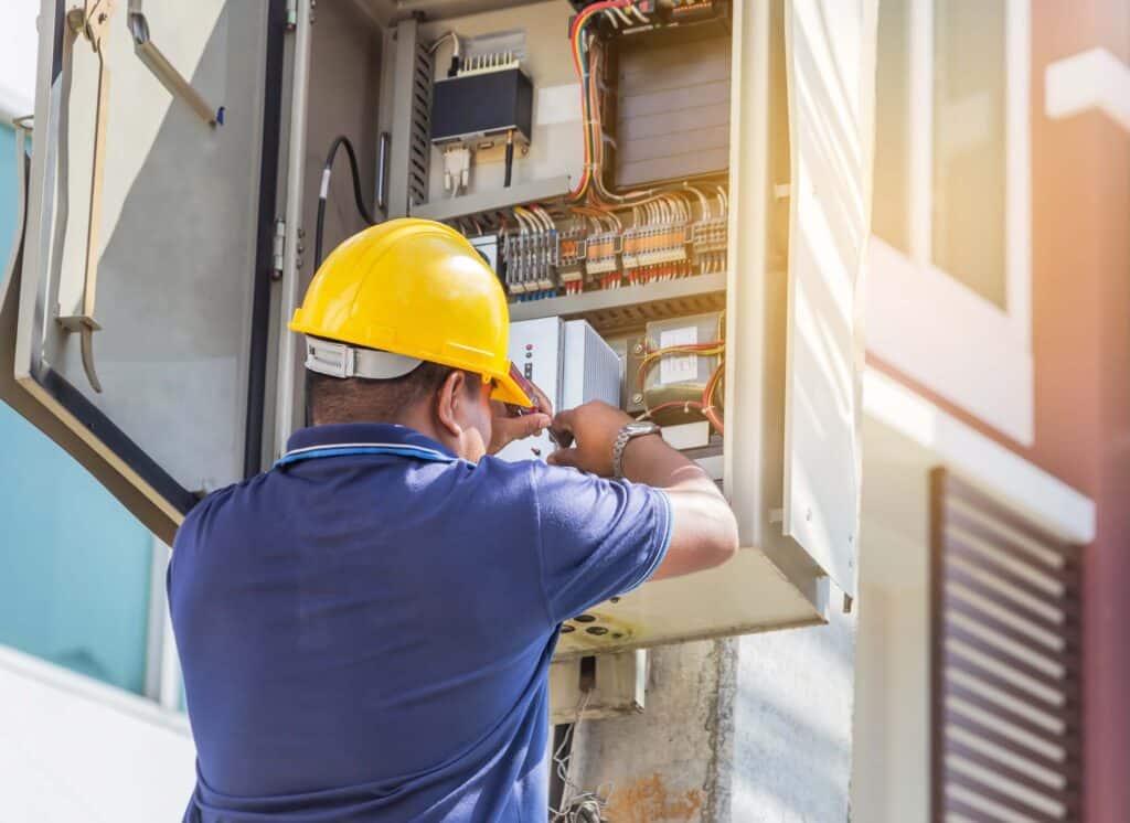technician working on circuit breaker